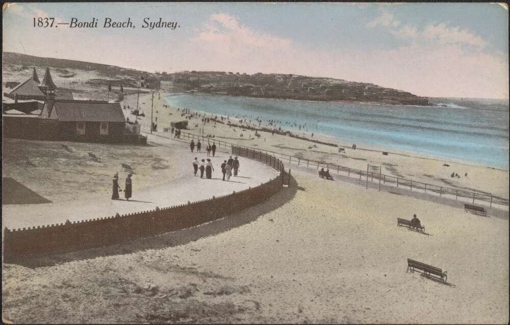Hand coloured postcard shows people on a boardwalk alongside Sydney's Bondi Beach
