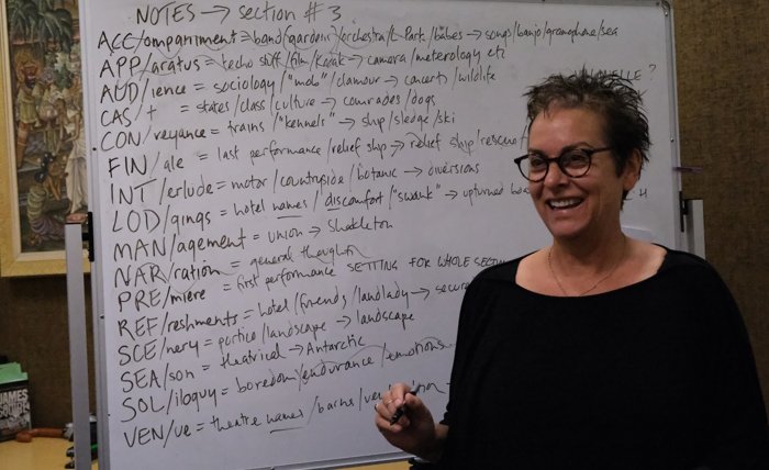 Photo of poet Dr Jordie Albiston at a whiteboard