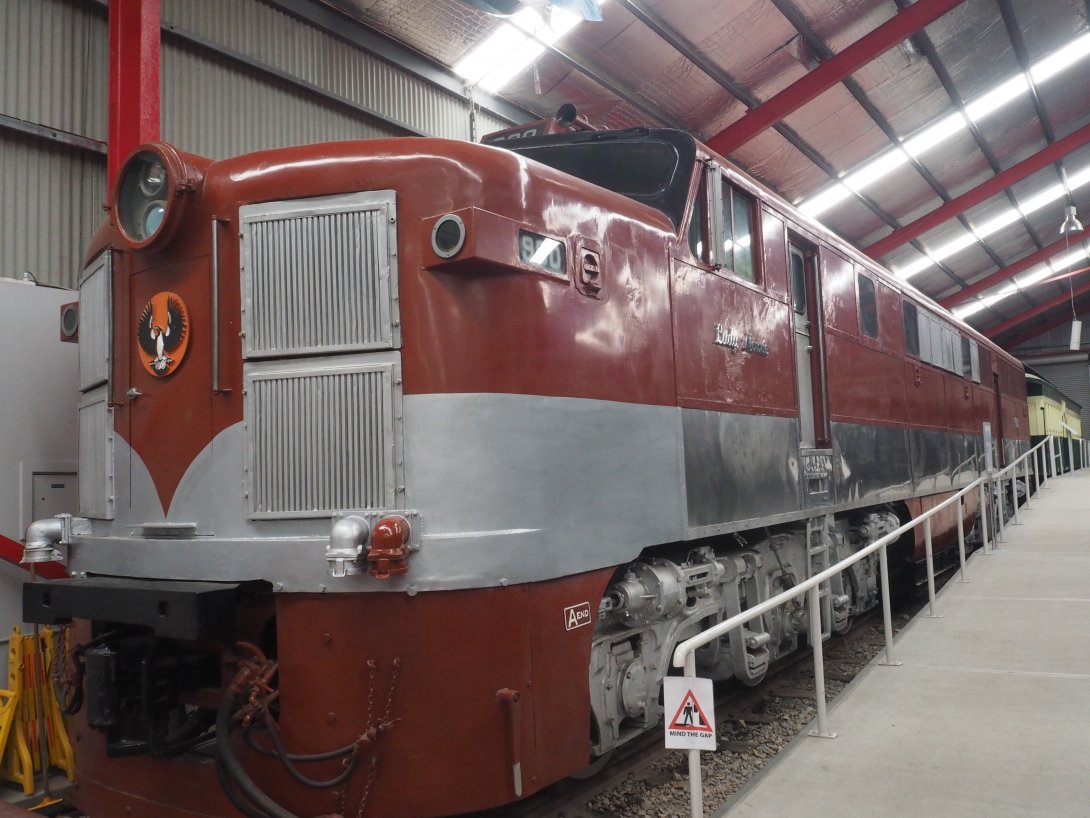Red and grey train at a museum