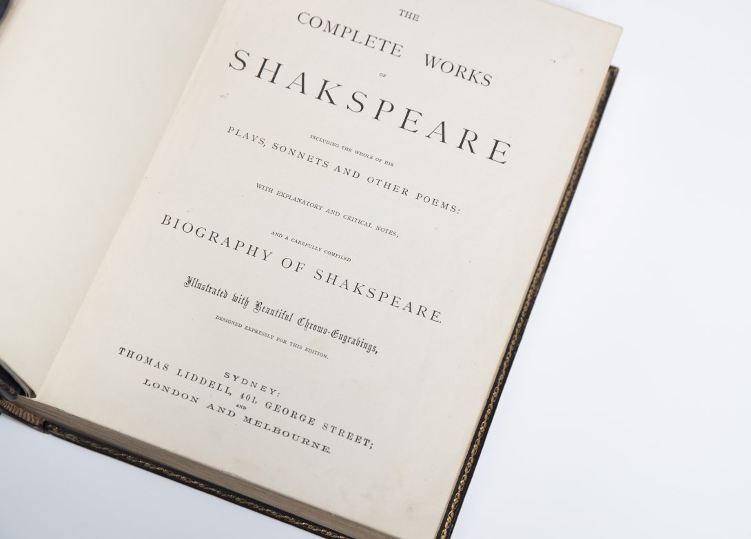 Old book open to title page reading 'The complete works of Shakespeare'