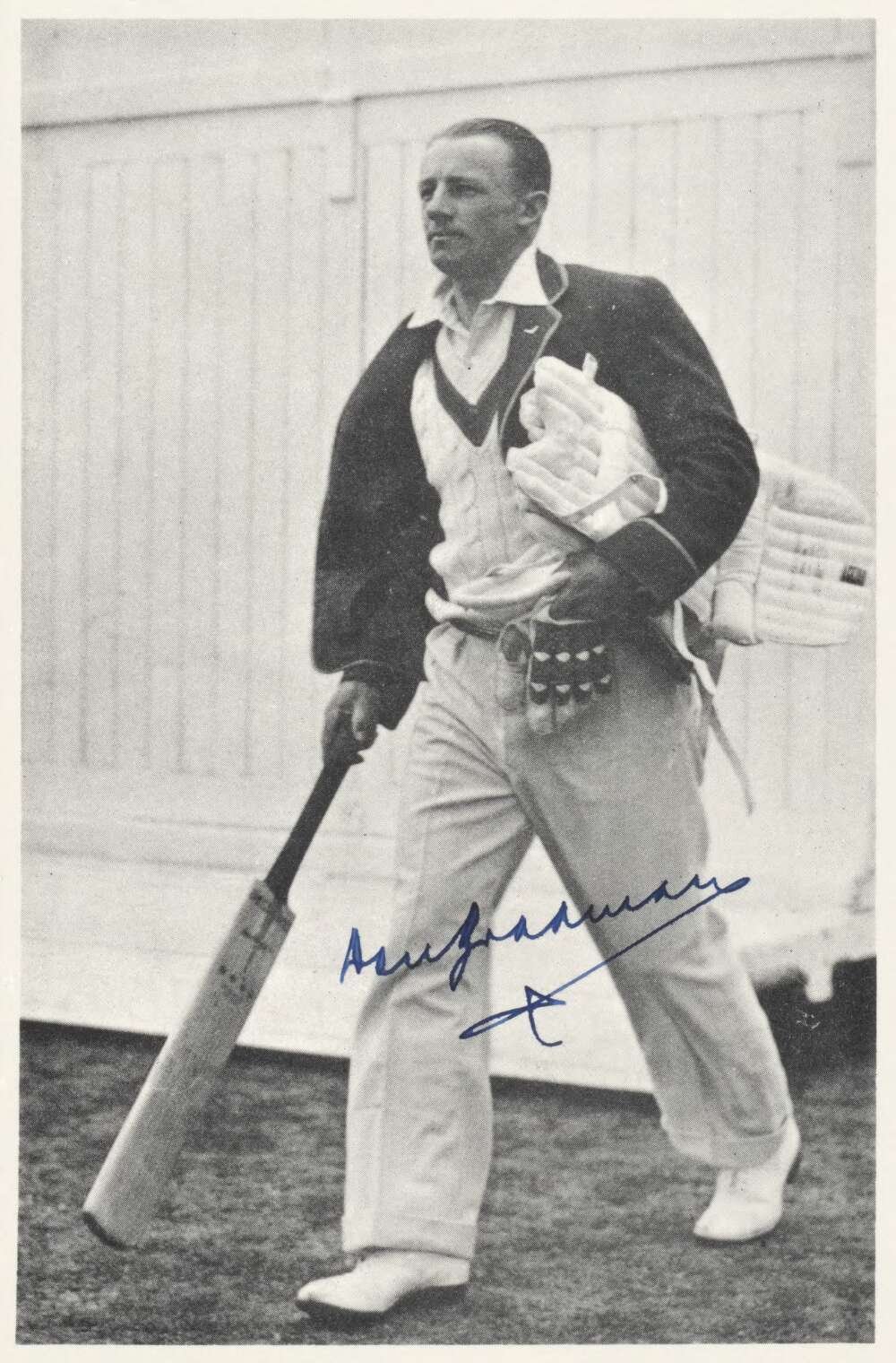 Portrait of Sir Don Bradman holding a bat