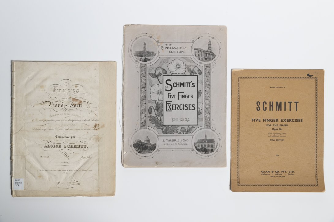 Image of three editions of Schmitt's exercises from three different time periods, early 19th century to mid 20th century with typography consistent with each period.
