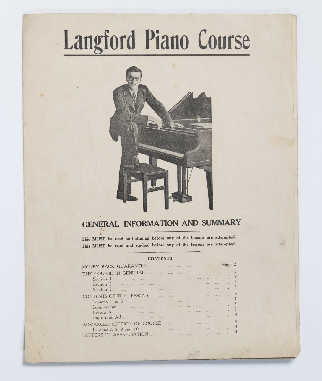 Image of the title page cover of a music text book featuring an image of a man with his foot on the stool of a piano, looking at the camera. 