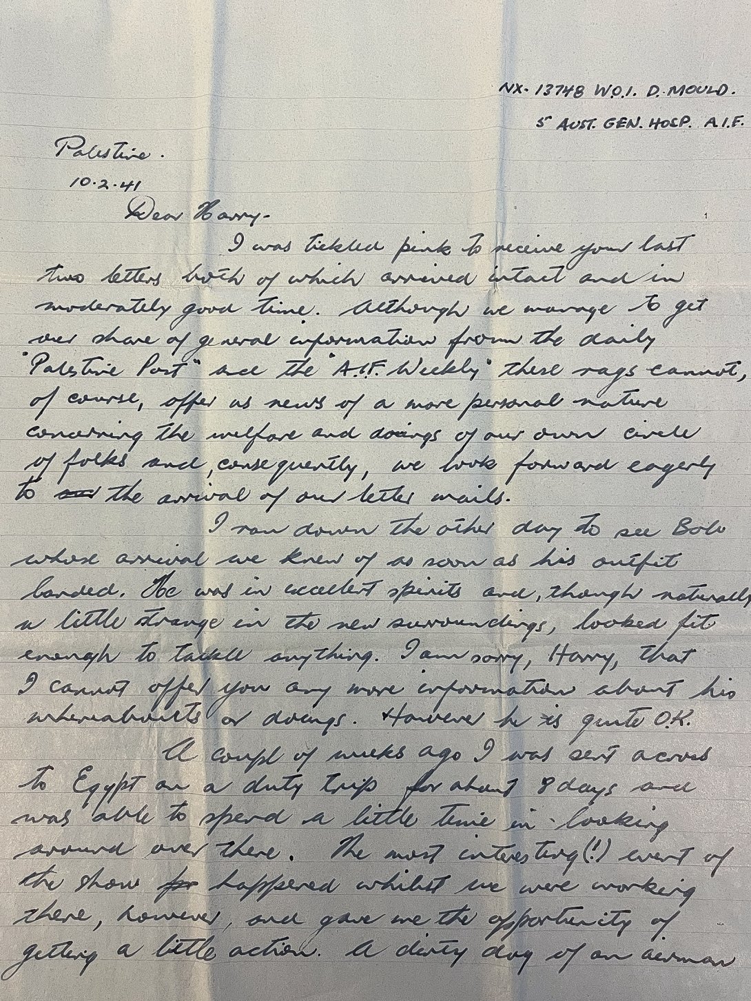 First page of a handwritten letter on blue lined paper