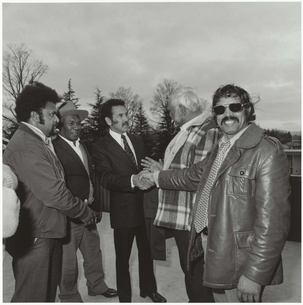 Mervyn Bishop (1945-), Charles Perkins shaking hands with members of the National Aboriginal Congress, 1978
