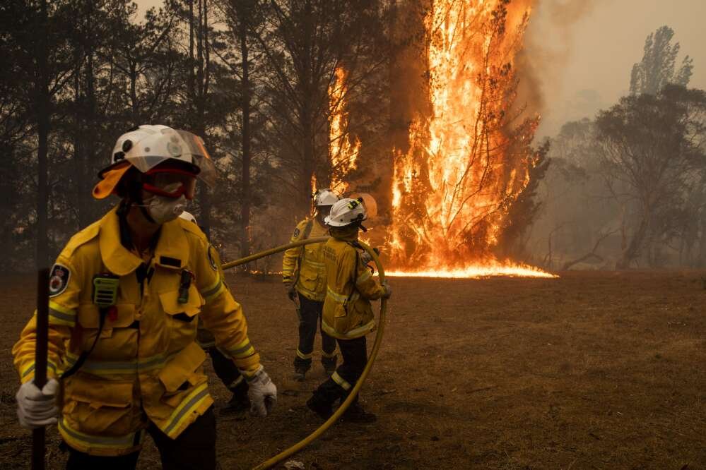 Davey, Sean. Rural Fire Service volunteers fight a bushfire on the Lans family property on Little Bombay Road, Braidwood, New South Wales, 2019 : , .