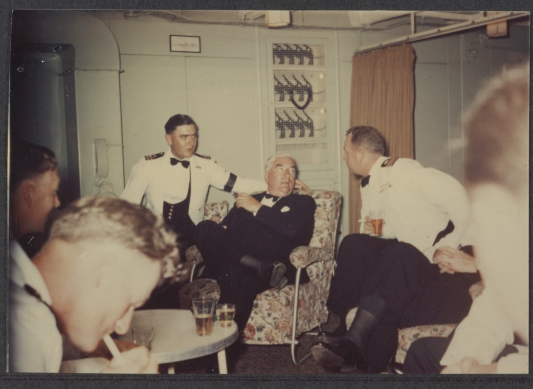 Sir Robert Menzies socialising with crew on a ship